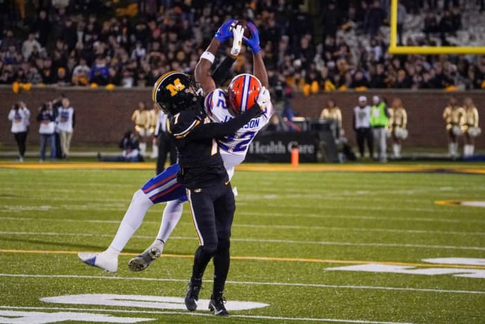 Nov 18, 2023; Columbia, Missouri, USA; Florida Gators wide receiver Kahleil Jackson (22) catches a pass as Missouri Tigers defensive back Kris Abrams-Draine (7) defends during the second half at Faurot Field at Memorial Stadium. Mandatory Credit: Denny Medley-USA TODAY Sports